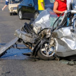 Remains of a fatal car crash and terribly damaged car