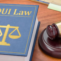 A DUI law book with a gavel A DUI law book with a gavel