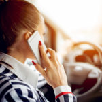 buiness woman talking on phone while driving buiness woman talking on phone while driving
