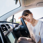 young female driver sleeping in vehicle young female driver sleeping in vehicle