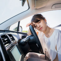 young female driver sleeping in vehicle young female driver sleeping in vehicle