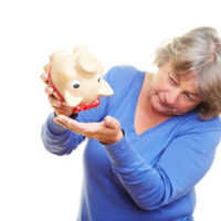 lady with empty piggy bank