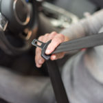 Man fastening seat belt in car Man fastening seat belt in car
