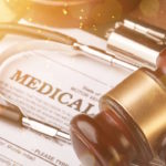 Medical malpractice forms, wooden gavel and stethoscope, close-up view Medical malpractice forms, wooden gavel and stethoscope, close-up view