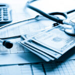 Health insurance application form with banknote and stethoscope concept for life planning Health insurance application form with banknote and stethoscope concept for life planning