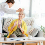Doctor mistreating senior woman in nursing home Doctor mistreating senior woman in nursing home