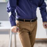 Handicapped Man Walking With Crutches Handicapped Man Walking With Crutches