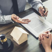 Real estate attorney consulting with client Real estate attorney consulting with client