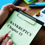 Man reads bankruptcy chapter 13 law in the office.